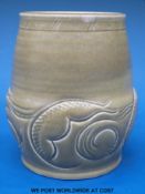 A Susie Cooper vase with sgraffito decoration on a green ground