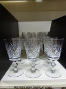 Two sets of six glasses, one set for white wine,