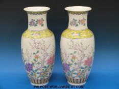 A pair of hand decorated Chinese vases (42cm tall)