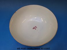 An early Worcester 'Dr Wall' period bowl, painted in puce monochrome with stylized plant sprigs,