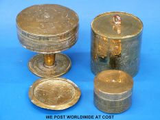 An African brass pedestal lidded dish decorated with animals,