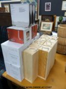 A large collection of boxed wine glasses, some branded Moet and Chandon,