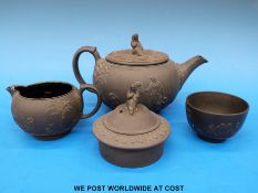 A Wedgwood black basalt figural teapot,