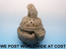 A Chinese jade reticulated tripod censer of spinach type with dragon head handle and Foo Dog finial