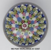 Clichy close pack millefiori glass paperweight with central red and white cane surrounded by six