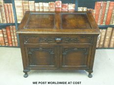 A small carved oak coffer (width 71cm)