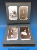 A full Edwardian postcard album comprising portraits,