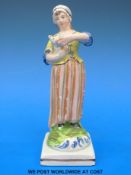 A pearlware figurine of a shepherdess