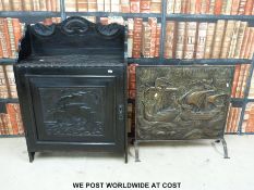 A small cupboard with a carved ship to front (width 69cm) and a ship fire screen