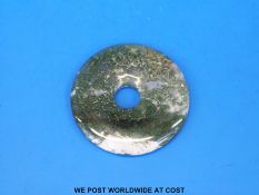 A Chinese spinach jade bi-disc (4.