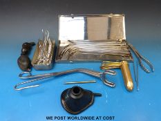 A set of white metal catheters in original stainless steel case, by Downs of London,
