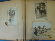 A Victorian / 20thC scrapbook containing cards, postcards and oddments including animals,