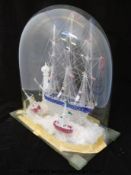 A spun and trailed clear glass ship with blue and cranberry decoration, possibly Nailsea,