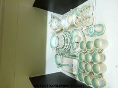 A collection of Susie Cooper items to include a cheese dish, two toast tacks and a cruet set,