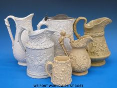 A collection of 19thC relief moulded jugs including a Ridgway jug decorated with a wedding