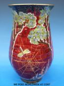 A Crown Devon vase decorated with flowers,