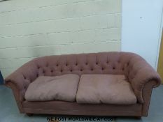 A Chesterfield upholstered button-backed sofa