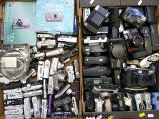 Two boxes of digital and film compact cameras including Nikon,