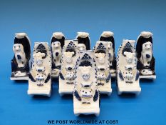 Ten Wilfred Gibson blue and white ceramic rocking chairs,