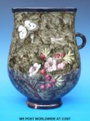 A hand-decorated pottery pedestal vase of flattened form by Howell & James London.
