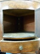 A Georgian mahogany bow-fronted corner washstand with single cupboard and drawer (H122 x W63