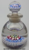 A 19thC English millefiori glass paperweight ink or scent bottle with multiple rings of canes to
