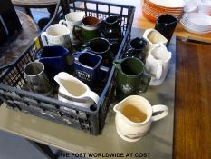 A collection of branded whisky water jugs
