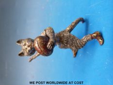 An Austrian cold painted figure of a cat with a rugby ball (height 6cm)