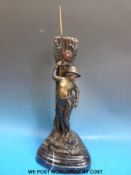 An unusual bronzed spelter figural vase of a boy fishing on shaped marble base (height 48cm)