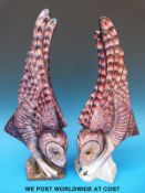 A pair of stylised owls by Michael Sutty Pottery (39cm tall,