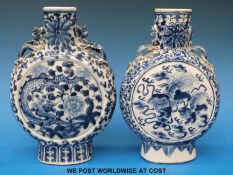 A 19thC Chinese moon flask with blue and white dragon decoration together with another (20.