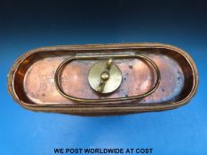 A copper carriage foot warmer (length 42cm) with related book