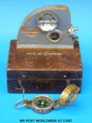 A brass sighting compass and a cased Watts 90° clinometer