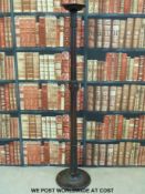 A mahogany torchere with carved leaf decoration (H166cm)