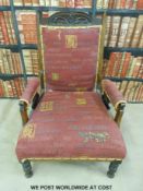 A carved oak upholstered armchair