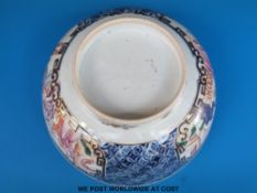 An 18thC Chinese Mandarin punch bowl with figural decoration on a blue ground (16.