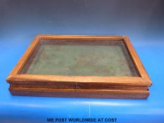 A small glass topped display cabinet (length 50cm)