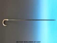 A c1900 white metal mounted rhino horn handled walking stick