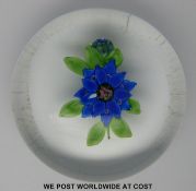 Baccarat or St Louis glass paperweight featuring central blue flower with pink centre,