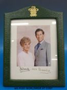 A signed Princess Diana and Prince Charles photograph dated 1992 in official crested leather