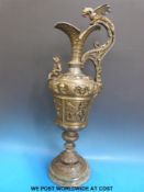 A very large cast metal ewer on marble base with dragon handle,
