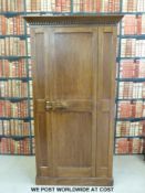 An oak panelled single door wardrobe (W102 x D56 x H193cm)