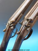 An unmatched pair of Joseph Lang & Sons side by side hammer action shotguns,