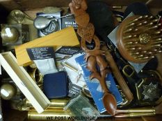 A quantity of collectables to include horse brasses, shell and bullet displays, coin sets,