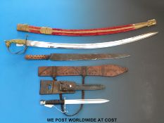 A Swiss 1957 pattern bayonet in scabbard with markings,