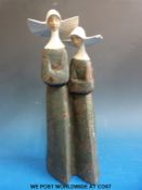 A Lladro figure of two nuns.