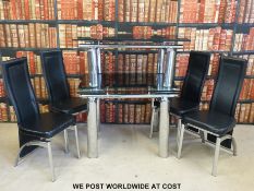 An Atlanta extending dining table (max length 139 x W75 x H72cm) set of four Manhattan dining