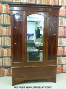 A late 19thC single drawer wardrobe with single drawer below (W132 x D50 x H207cm)