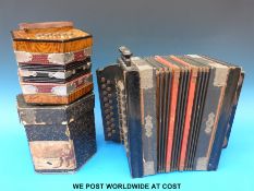 A German Anglo concertina with 20 metal buttons in original box together with a two row c1910