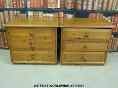 A pair of pine bedside chests of three drawers (width 63cm)